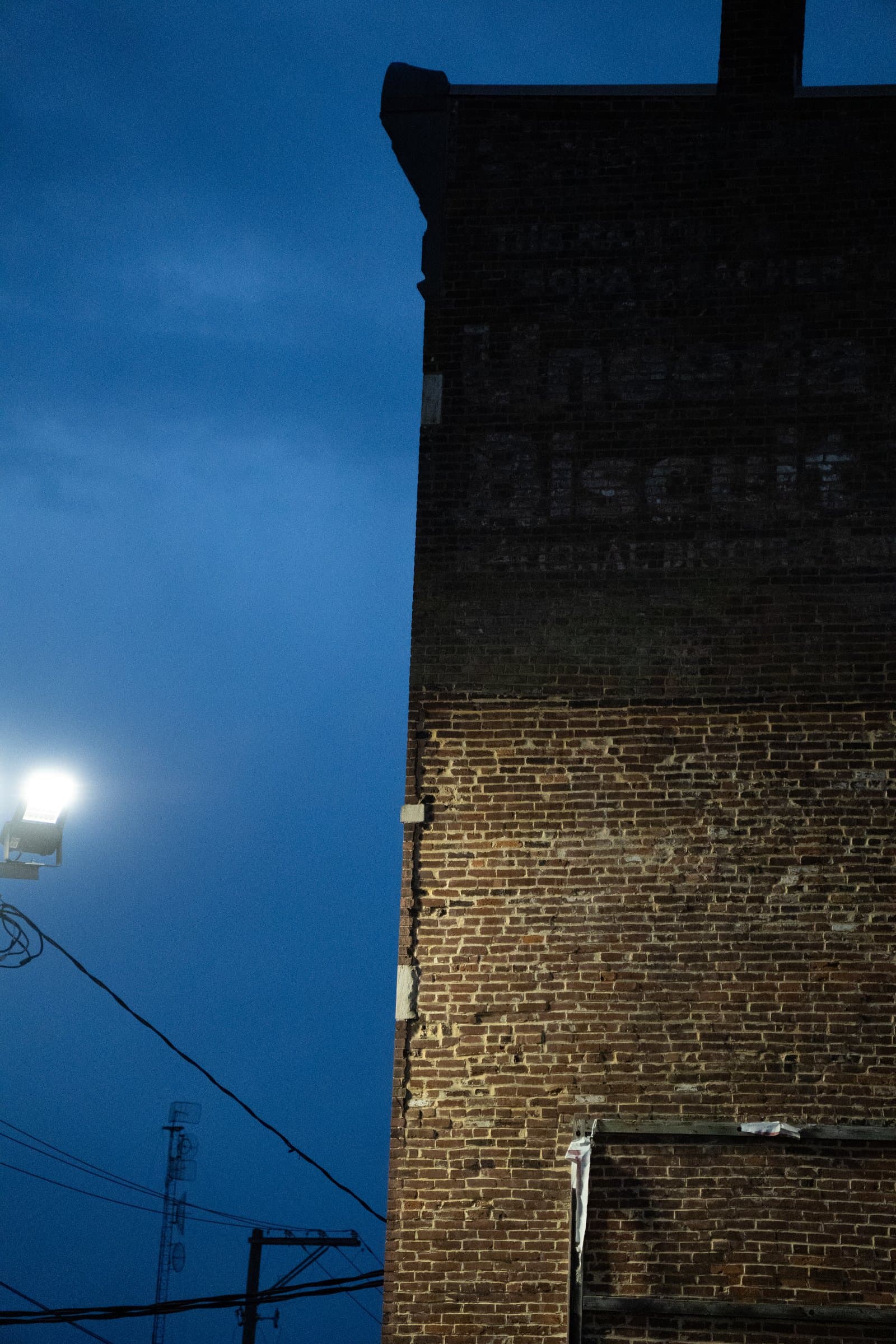 A brick wall with a faded sign at blue hour, Lexington